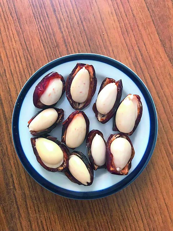 Soaked Almonds in date halves