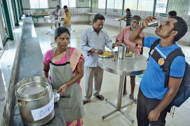 Amma canteen staff distributing Nilavembu Kashayam at a centre in Egmore. (Photo: DC)