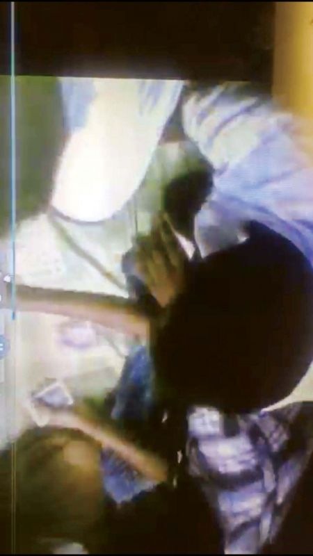 Screenshot of the video showing inmates playing cards
