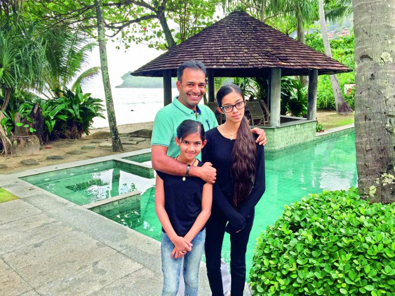 family holiday: Anees Ahmed with his daughters at a villa in Phuket
