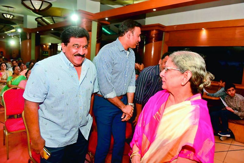 Former cricketer and administrator V. Chamundeswarnath greets late M. V. Sridharâ€™s mother Dr Pushpa.