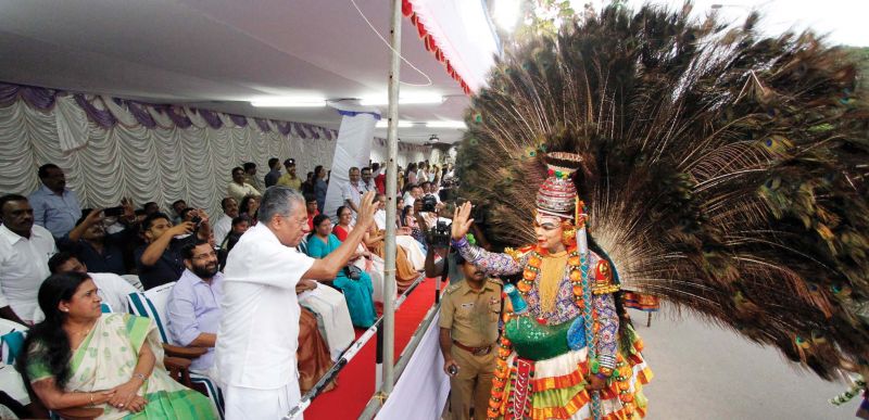 An artiste participating in the Onam Pageantry being honoured by Chief Minister Pinarayi Vijayan in Thiruvananthapuram on Saturday. (Photo: A.V. MUZAFAR)