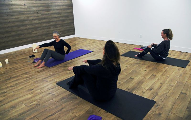 Writer and editor Camille LeFevre (left), leads a pilates work at ModernWell in Minneapolis. (Photo: AP)