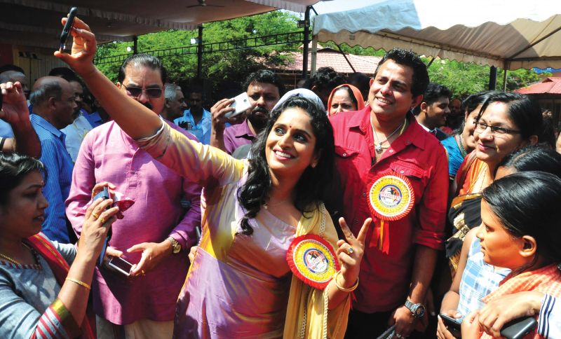 Actor Surabhi Lakshmi takes selfie with singer Franco at the festival venue.