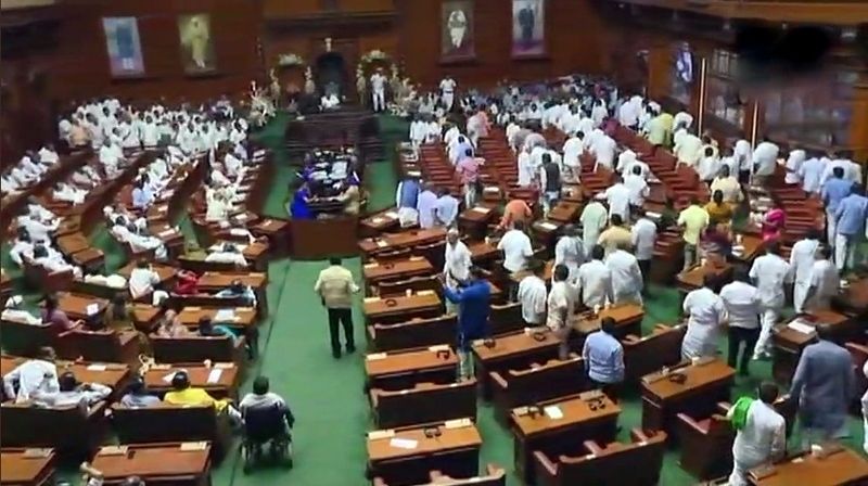 BJP lawmakers stage walkout ahead of H D Kumaraswamy's trust vote in the Karnataka Assembly. (Photo: ANI | Twitter)