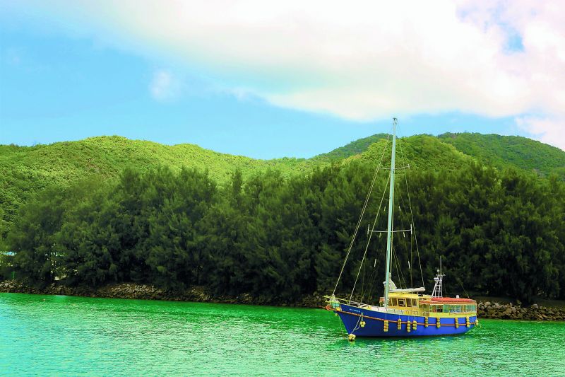 Imagine if you owned this boat and the island behind? Spotted around La Digue island.