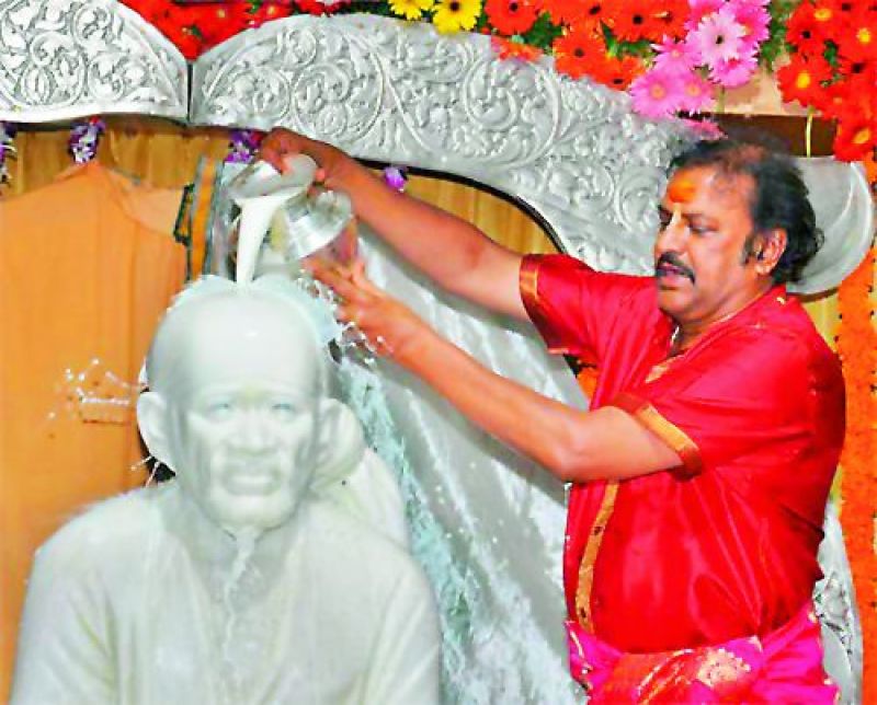 Mohan Babu performs abhishekam on Guru Poornima at Film Nagar.