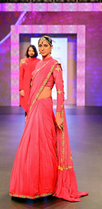 A model walking the ramp wearing one of Rachna's creation at Mysore Fashion Week
