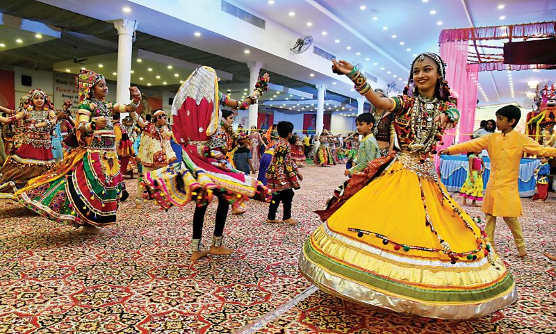 Dancers participate in dandiya as part of Dasara Festival at Palace Grounds in Bengaluru  (Photo:shashidhar b)