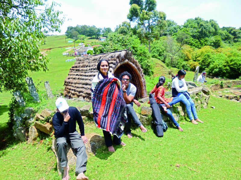 Sharada with her husband (third from left), brother and daughter at a Toda hut in Nilgiri