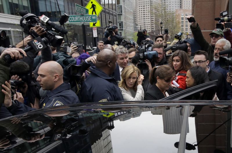 Felicity Huffman, center, gets into a vehicle followed by her brother Moore Huffman Jr., outside federal, Monday, May 13, 2019, in Boston, where she pleaded guilty to charges in a nationwide college admissions bribery scandal. (AP Photo/Steven Senne) 