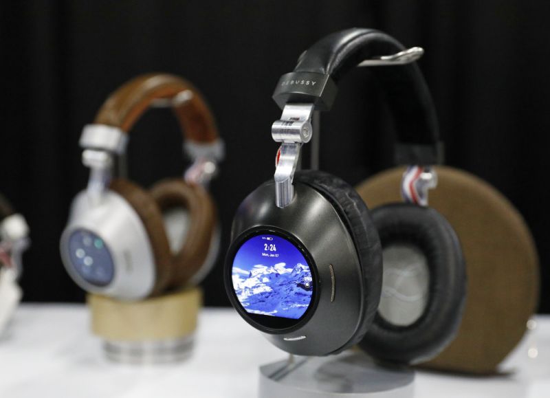 The Prelude smart headphones are on display at the Debussy Audio booth at CES Unveiled during CES International, Sunday, Jan. 6, 2019, in Las Vegas. The standalone device can stream high fidelity music and is compatible with several streaming services. (AP Photo/John Locher)
