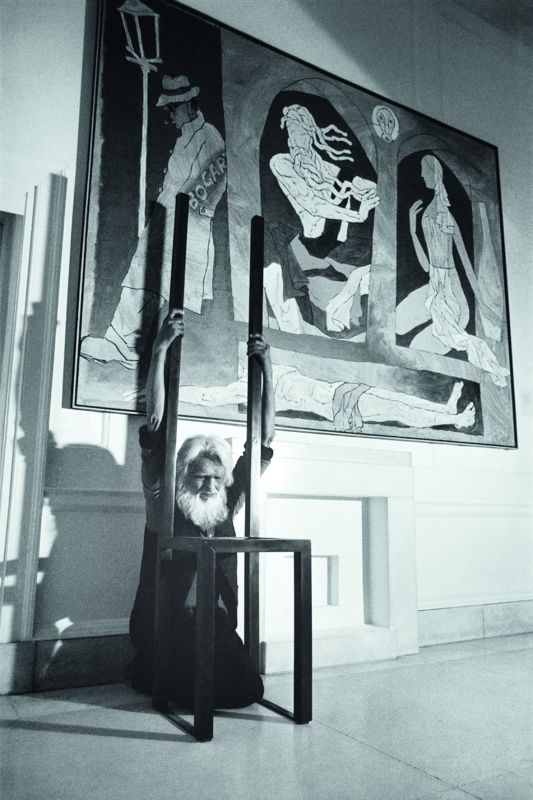 Husain in front of his painting.