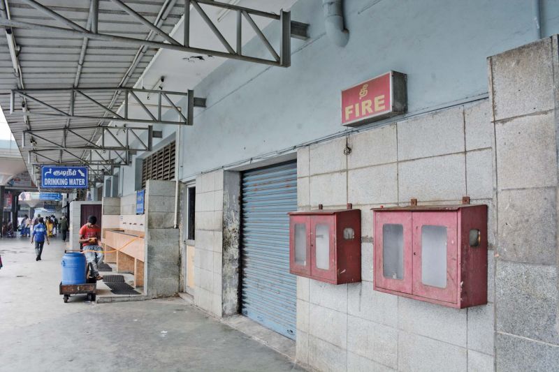 Empty fire extinguishers boxes are seen in Koyambedu bus terminus