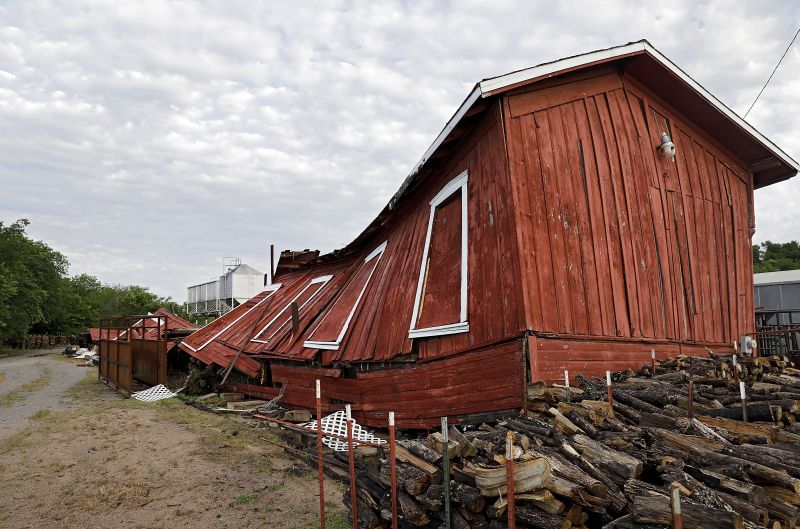 An historic railroad building owned by Farmers Feed Store was destroyed by a suspected tornado which hit Sapulpa, Okla., early Sunday, May 26, 2019. Farmers Feed Store uses the building, which has been there since at least the early 1900s, for storage. (Mike Simons/Tulsa World via AP) 