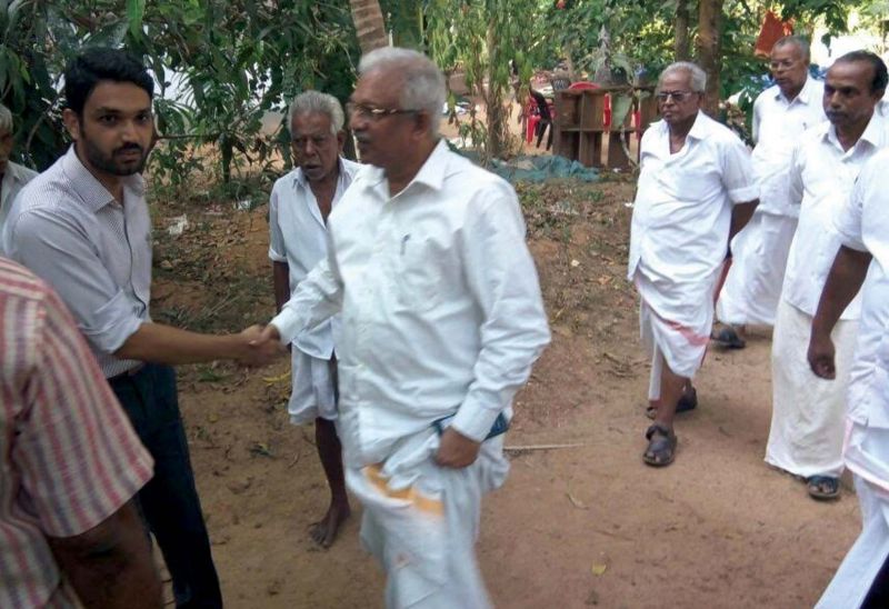 Kannur district collector Mir Mohammed Ali and CPM district secretary P. Jayarajan at the house of slain BJP worker E. Santhosh in Andallur