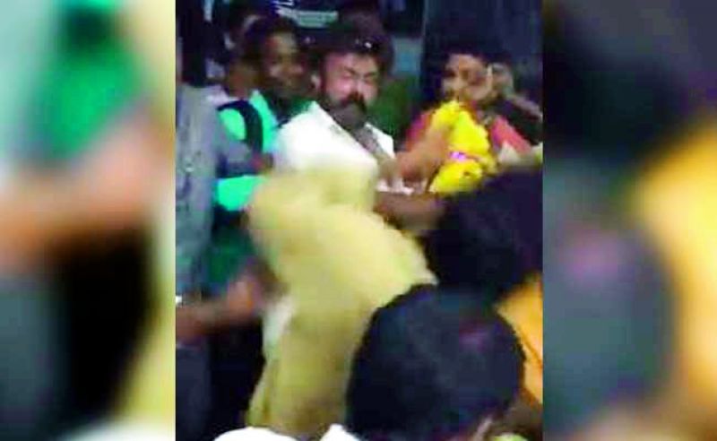 Balakrishna is seen  slapping a fan