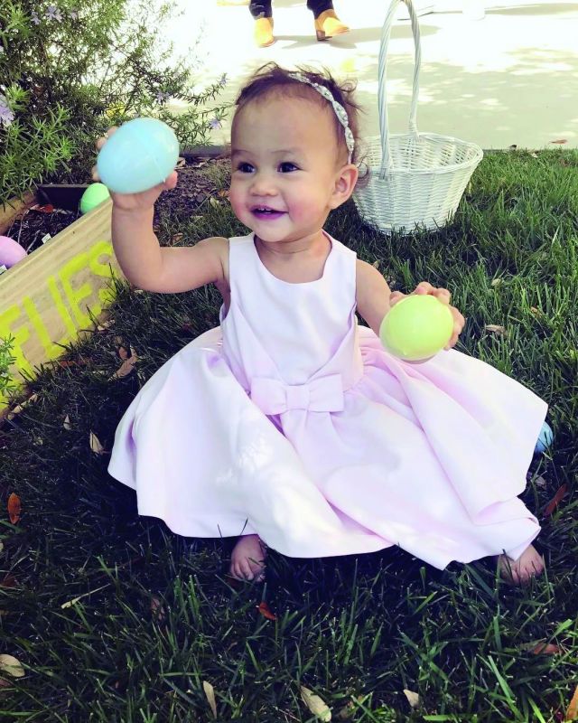 John Legend and Chrissy Teigen's daughter Luna plays with Easter eggs