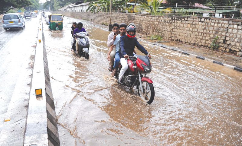 The highway was flooded in many parts slowing down the traffic, while fallen trees and branches made it worse.