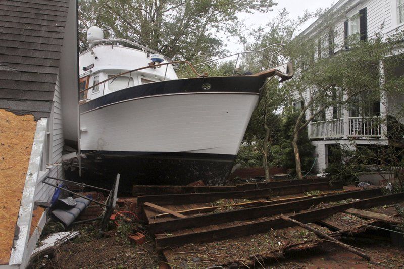 A 40-foot yacht lies in the yard of a storm-damaged home on East Front Street in New Bern, North Carolina on Saturday, September 15, 2018. The boat washed up with storm surge and debris from Hurricane Florence. (Photo: AP)