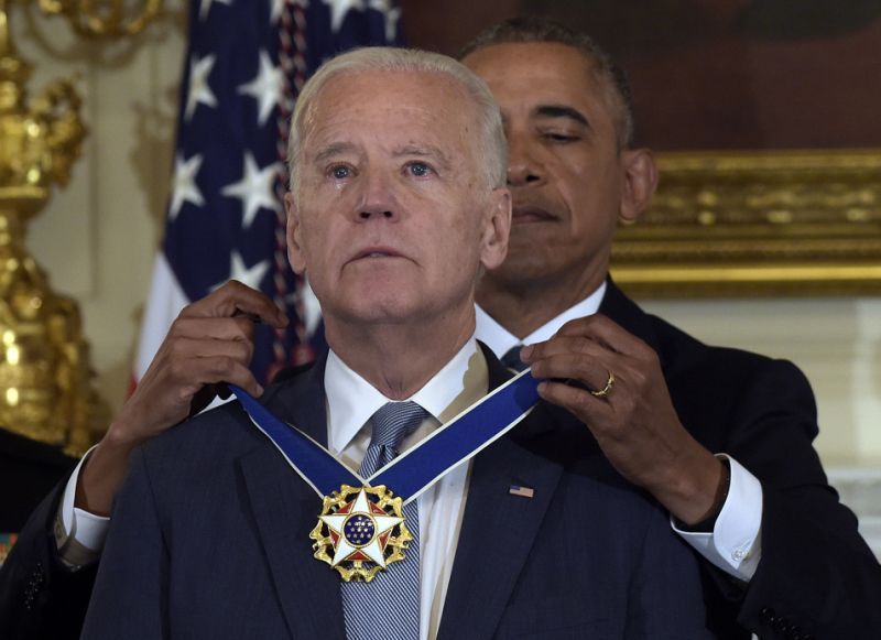 President Barack Obama presents Vice President Joe Biden with the Presidential Medal of Freedom during a ceremony in the State Dining Room of the White House. (Photo: AP)