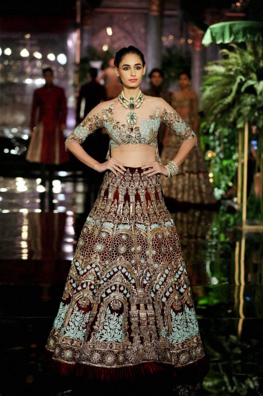 A model wears a lehenga from Manish Malhotra's latest collection