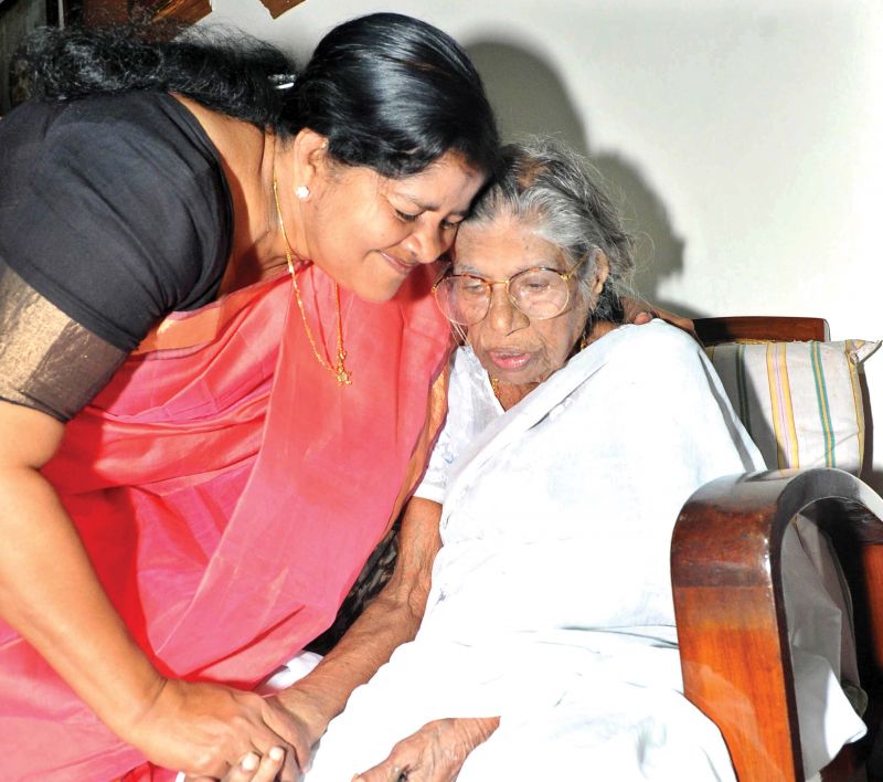 J. Mercykutty Amma, Minister for Fisheries, visits K.R. Gowriamma at her residence in Alappuzha on Saturday. (Photo: DC)