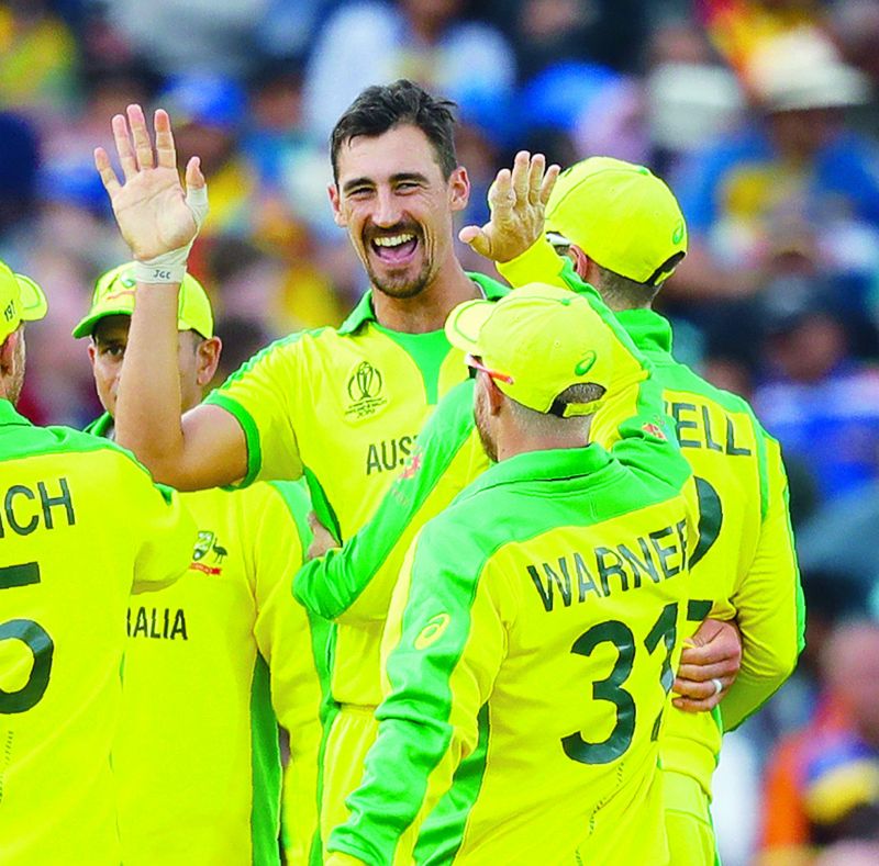 Australiaâ€™s Mitchell Starc (left) celebrates taking the wicket of Sri Lankaâ€™s Kusal Mendis in their World Cup match at The Oval in London on Saturday. (Photo: AP) 