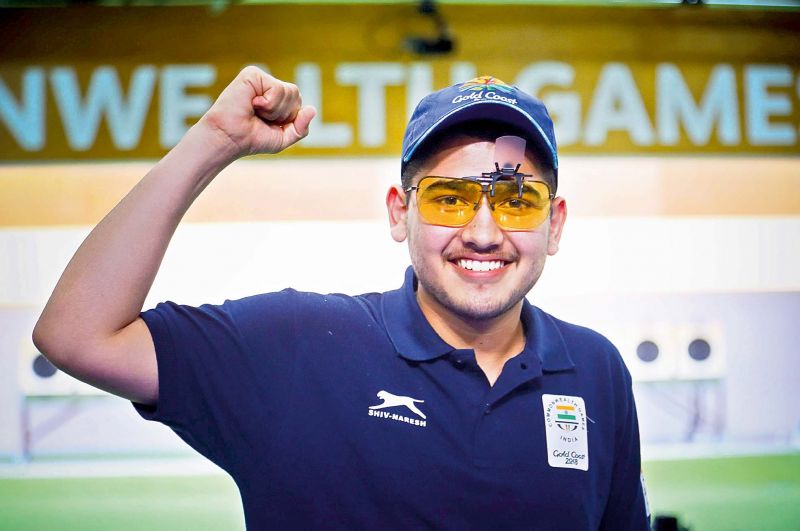 Smiling Assassin: Anish Bhanwala, 15, became India's youngest medallist at the Games.