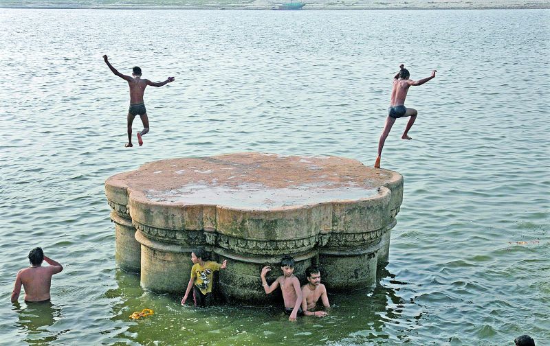 Leaping into cool waters at Varanasi