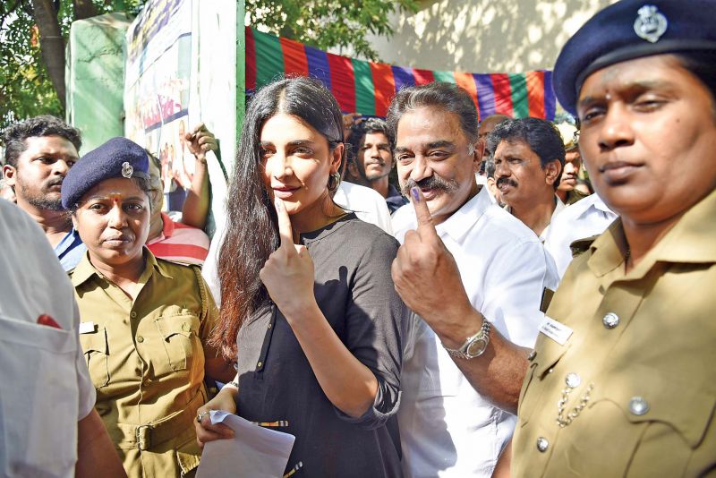 Actor and MNM chief Kamal Haasan and his daughter Shruti proudly display their inked fingers. (Photo: DC)