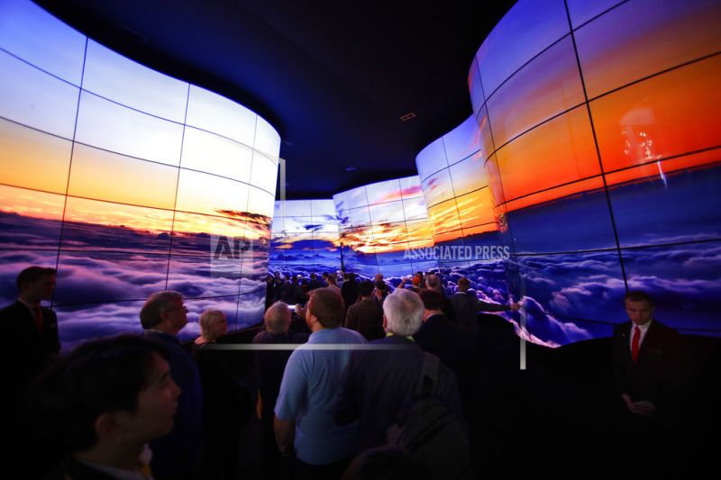 Attendees look at an installation built with LG OLED displays.