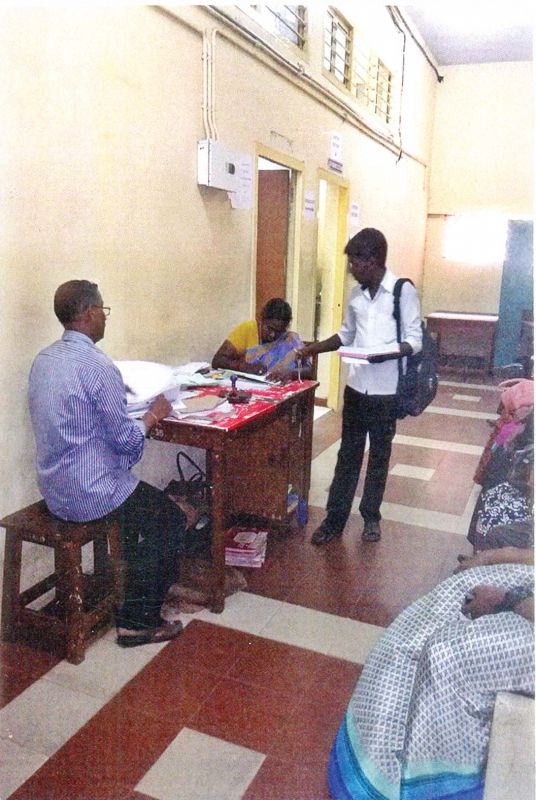 Space constraint: Filing section staff function on the corridor of a court hall and affix seal on a petition from a litigant before filing it in the family court.