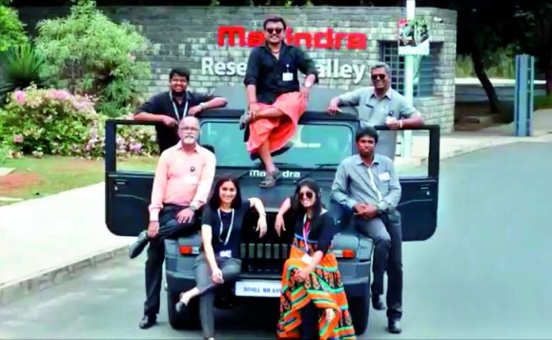 Bala, one of Anand Mahindra's staff dressed as Kaala Bala' atop the sought after car