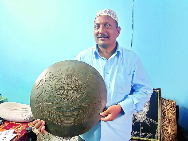 Mohammed Abdul Kareem  shows the royal insignia of the seventh Nizam.