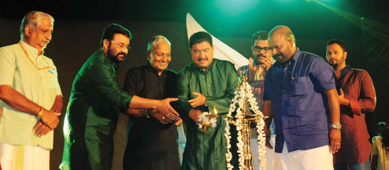 Actor Mohanlal, industrialist B.R. Shetty and Kalamandalam Gopi light the traditional lamp to start the birthday celebrations. Melam maestro Peruvanam Kuttan Marar, agriculture minister V.S. Sunil Kumar are also seen. (Photo: DC)