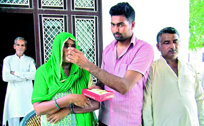 Saurabh's family celebrates at their home in Kalina, Uttar Pradesh (Photo courtesy: Dainik Jagaran)