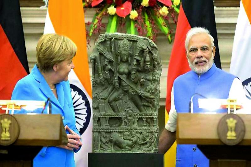 German Chancellor Angela Merkel returned a stone carving of Goddess Durga to India (bottom) The Amravati relief that was stolen in 2005