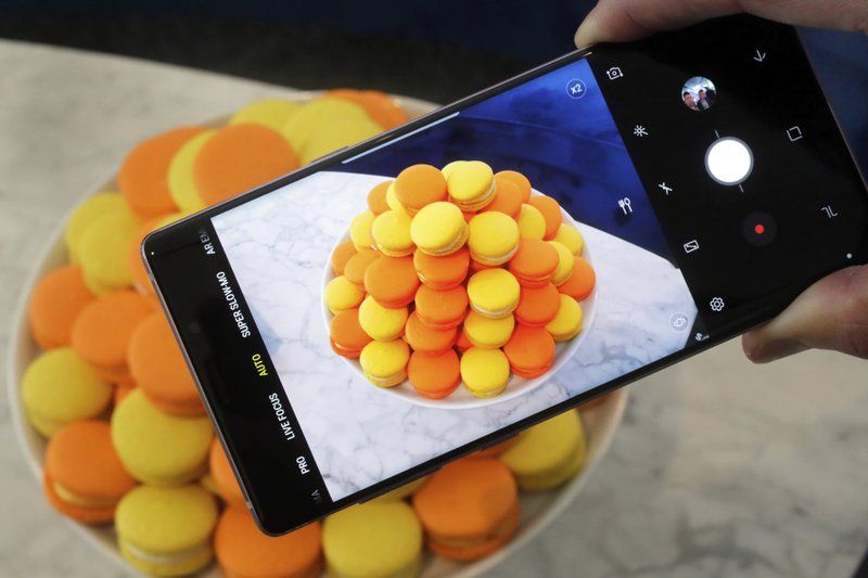 The Samsung Galaxy Note 9 is shown in New York. For $1,000, the Galaxy Note 9 is a superb phone thatâ€™s the best Samsung has to offer. But for a few hundred dollars less, the Galaxy S9 offers many of the features the Note 9 is now getting, including zippy speeds and camera improvements. (AP Photo/Richard Drew, File)