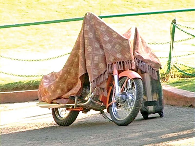 The bike used by Gurmeet Ram Rahim Singh to ride in the Govt Botanical Garden lawns in Ooty in May 2011 covered by cloth after the officials seized it. 