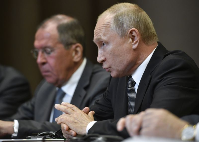 Russian President Vladimir Putin, right, speaks to U.S. Secretary of State Mike Pompeo, during their talks in the Black Sea resort city of Sochi, southern Russia, Tuesday, May 14, 2019. Pompeo arrived in Russia for talks that are expected to focus on an array of issues including arms control and Iran. Russian Foreign Minister Sergey Lavrov is on the left. (Alexander Nemenov/Pool Photo via AP) 