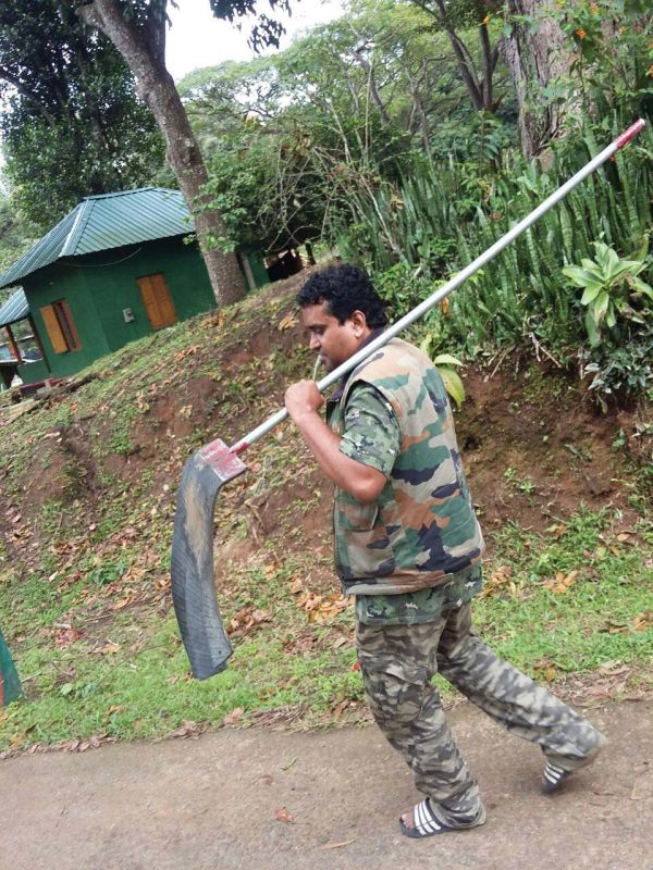 A forest guard with a fire beater in Bandipur reserve forest