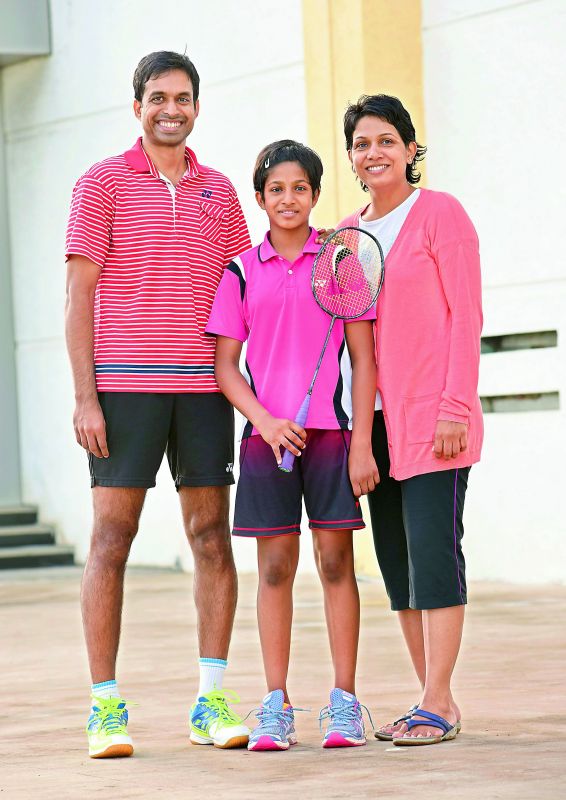 Proud family: Gopichand with daughter Gayatri and wife P.V.V. Lakshmi.