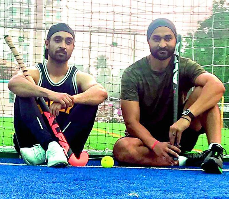 Diljit Dosanjh (left), who is playing the role of Sandeep Singh in the movie Soorma, poses with the real life  hockey champion Sandeep Singh (right).