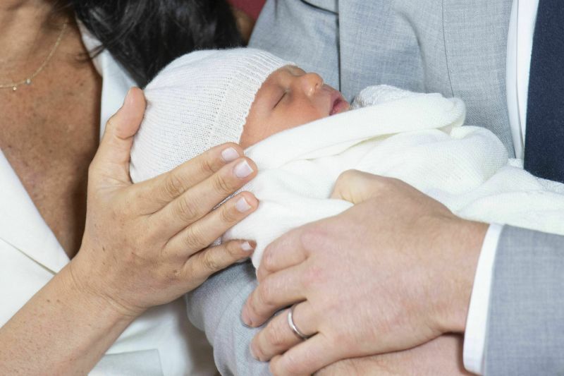 Baby Sussex, whose name has not been announced, lay silently, swaddled in a white blanket and wearing a matching knitted cap at the press event. (Photo: AP)