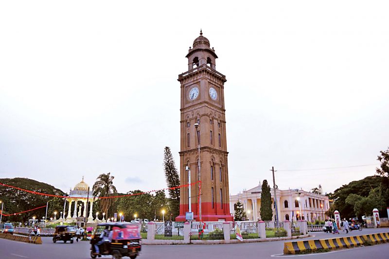 The iconic big clock tower near the famous Mysuru Palace is facing a threat of collapse unless the MCC authorities act swiftly. (Photo: DC)