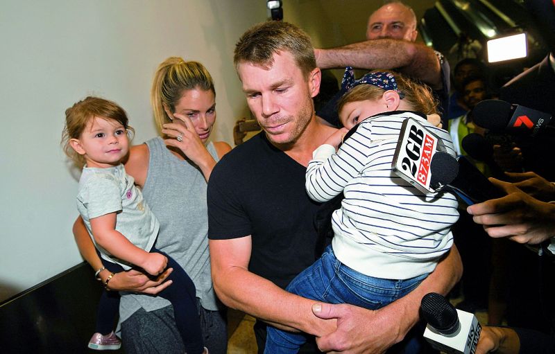 david warner looks teary-eyed, while his wife Candice broke down at the airport.