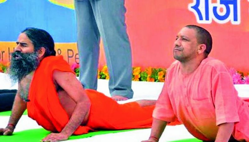 Yogi Adityanath does yoga with Baba Ramdev