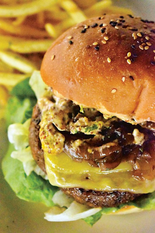 The chef's tenderloin burger came with caramelised onions, in a sesame brioche bun  yummy we slobbered over a juicy patty doused with cheddar, mustard mayo and lettuce that did away with all our feminine airs we would have preferred add-ons on the side. 