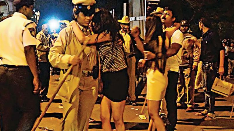 The photograph of distraught woman being comforted  by policewoman on the iconic M.G.- Brigade Road New Year's/